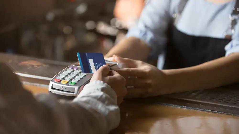 Payment transaction at Merchant Pro Inc with credit card and POS terminal.
